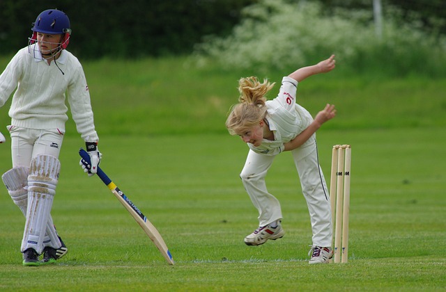 Bowler celebrating a wicket, pure aggression and triumph.